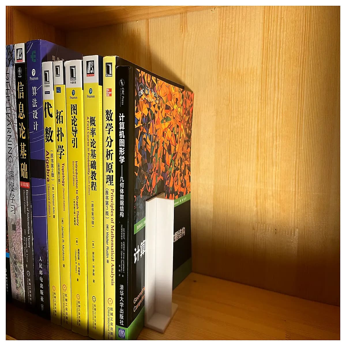 modular desk organizer set with interlocking base blocks and connector pins for stacking books and stationery storage