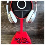 Squid Game Soldier Mask Headphone Holder Phone Stand Mobile Accessory Mount Bracket Support